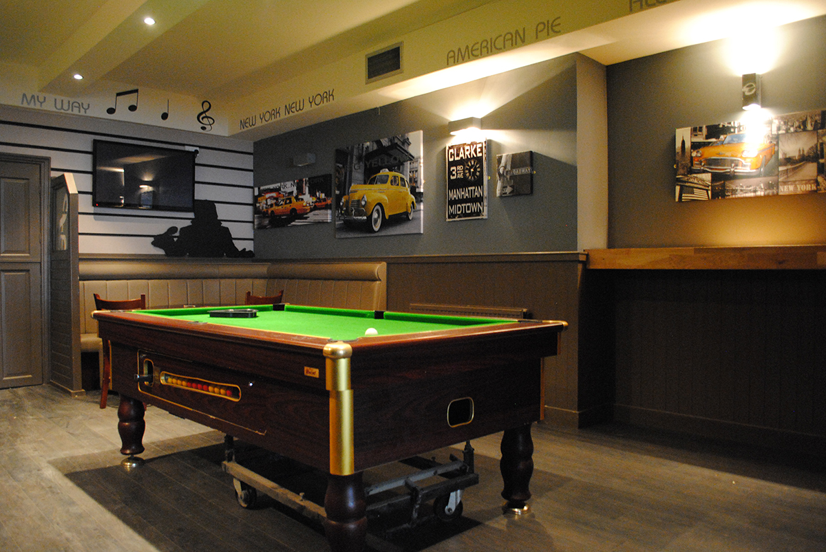 Enjoy your drink over a game of pool